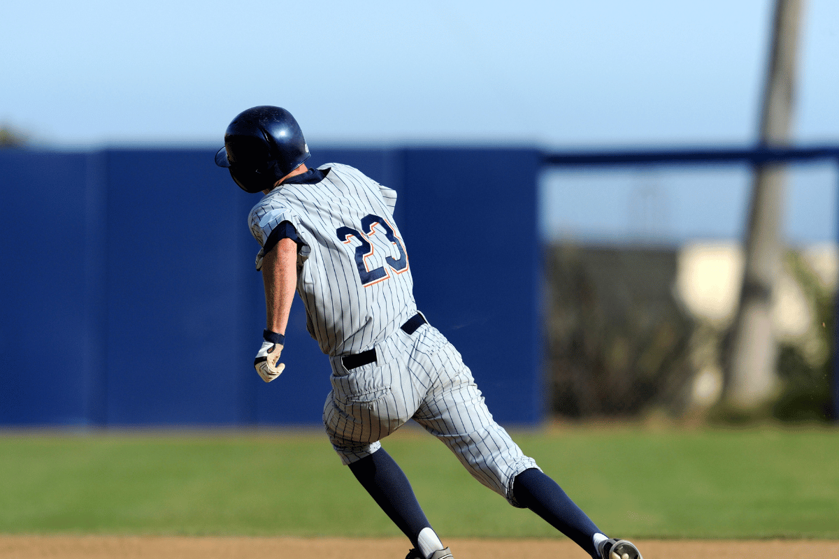 a baseball player running to second base