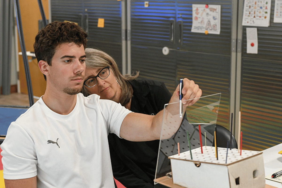 a vision therapist with a patient getting vision therapy services